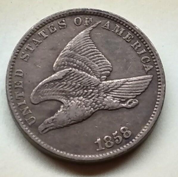 1857-Flying-Cent---Strange-Rim-Reverse